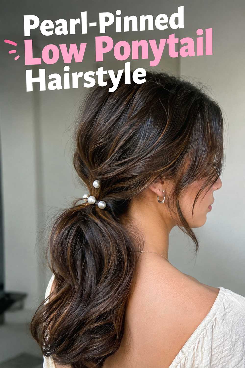 9. Pearl Pinned Low Ponytail Hairstyle