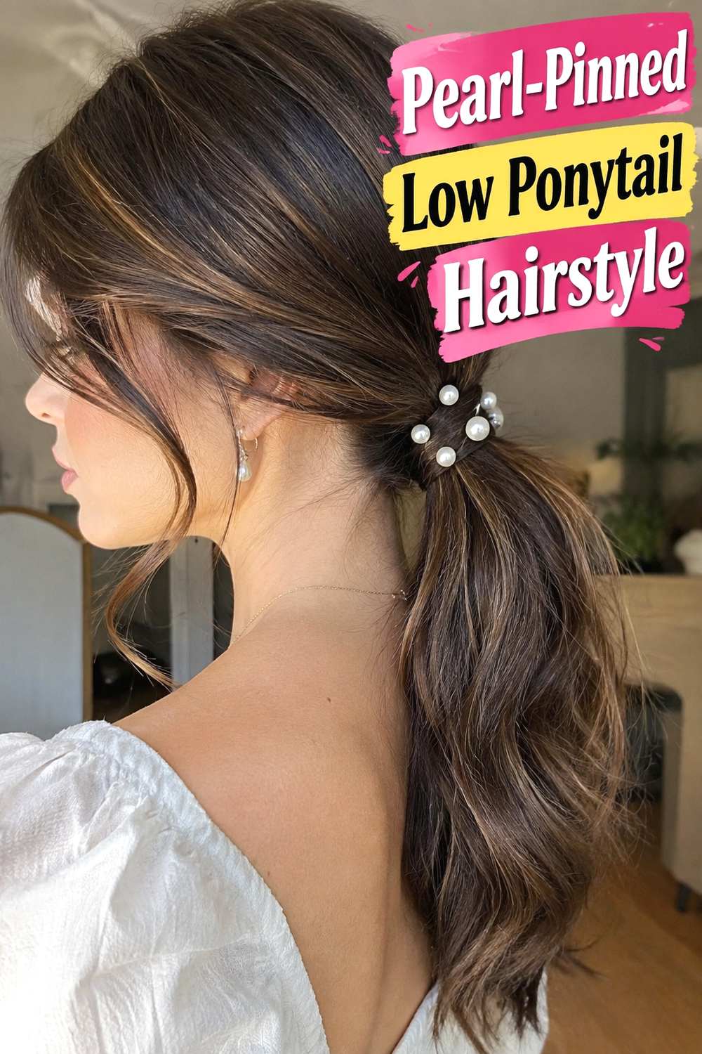 Pearl-Pinned Low Ponytail Hairstyle