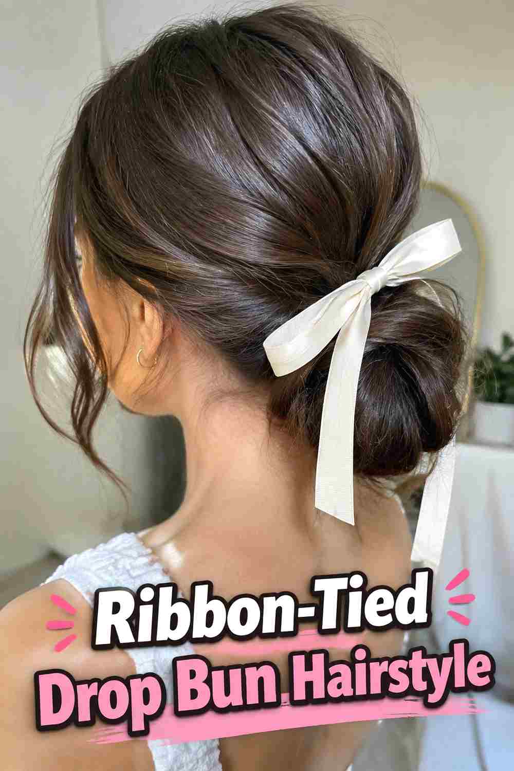 16. Ribbon Tied Drop Bun Hairstyle