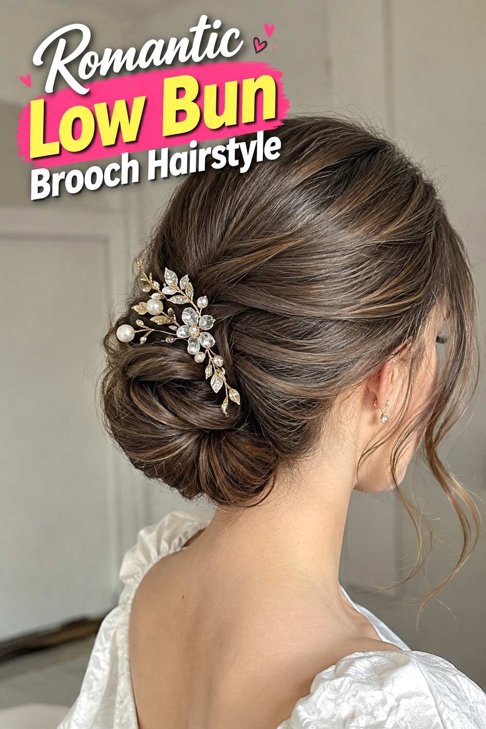2. Romantic Low Bun Brooch Hairstyle