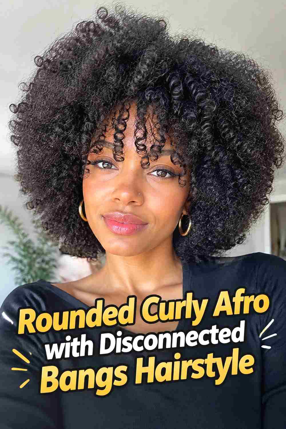 7. Rounded Curly Afro With Disconnected Bangs Hairstyle
