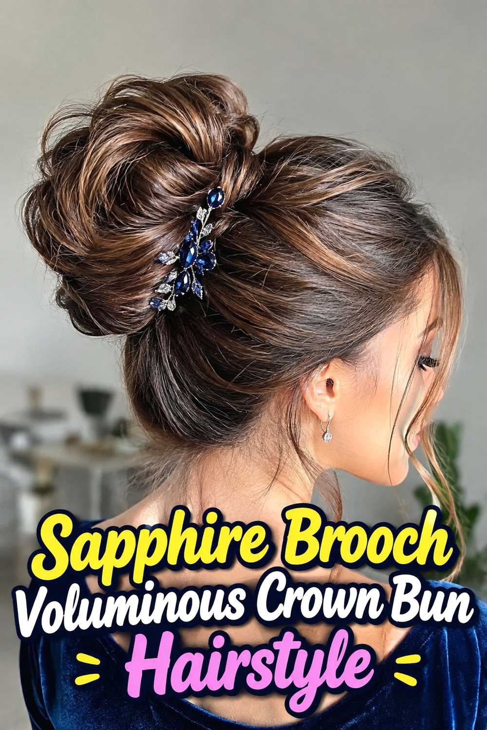 16. Sapphire Brooch Voluminous Crown Bun Hairstyle