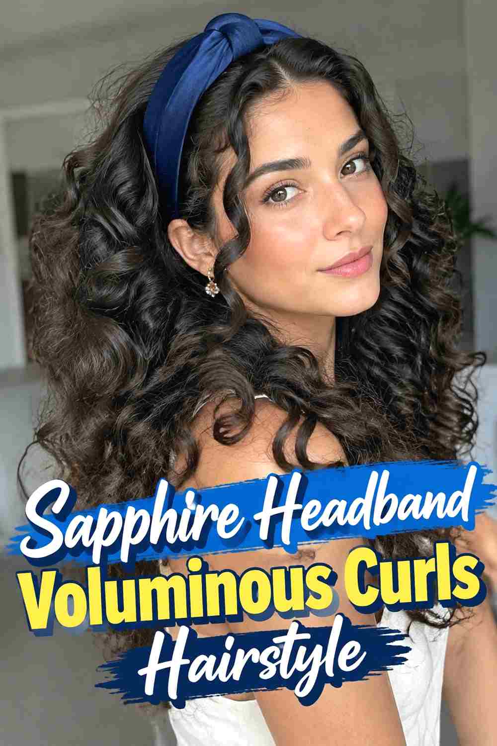 16. Sapphire Headband Voluminous Curls Hairstyle