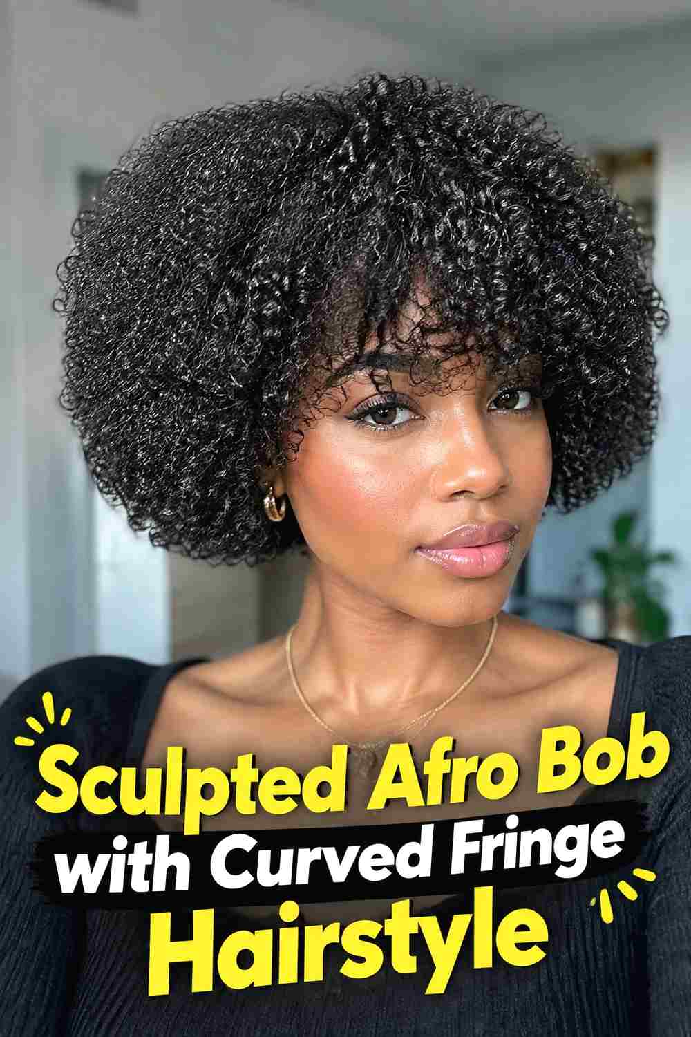 15. Sculpted Afro Bob With Curved Fringe Hairstyle