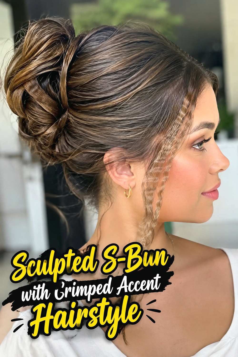 Sculpted S-Bun with Crimped Accent Hairstyle