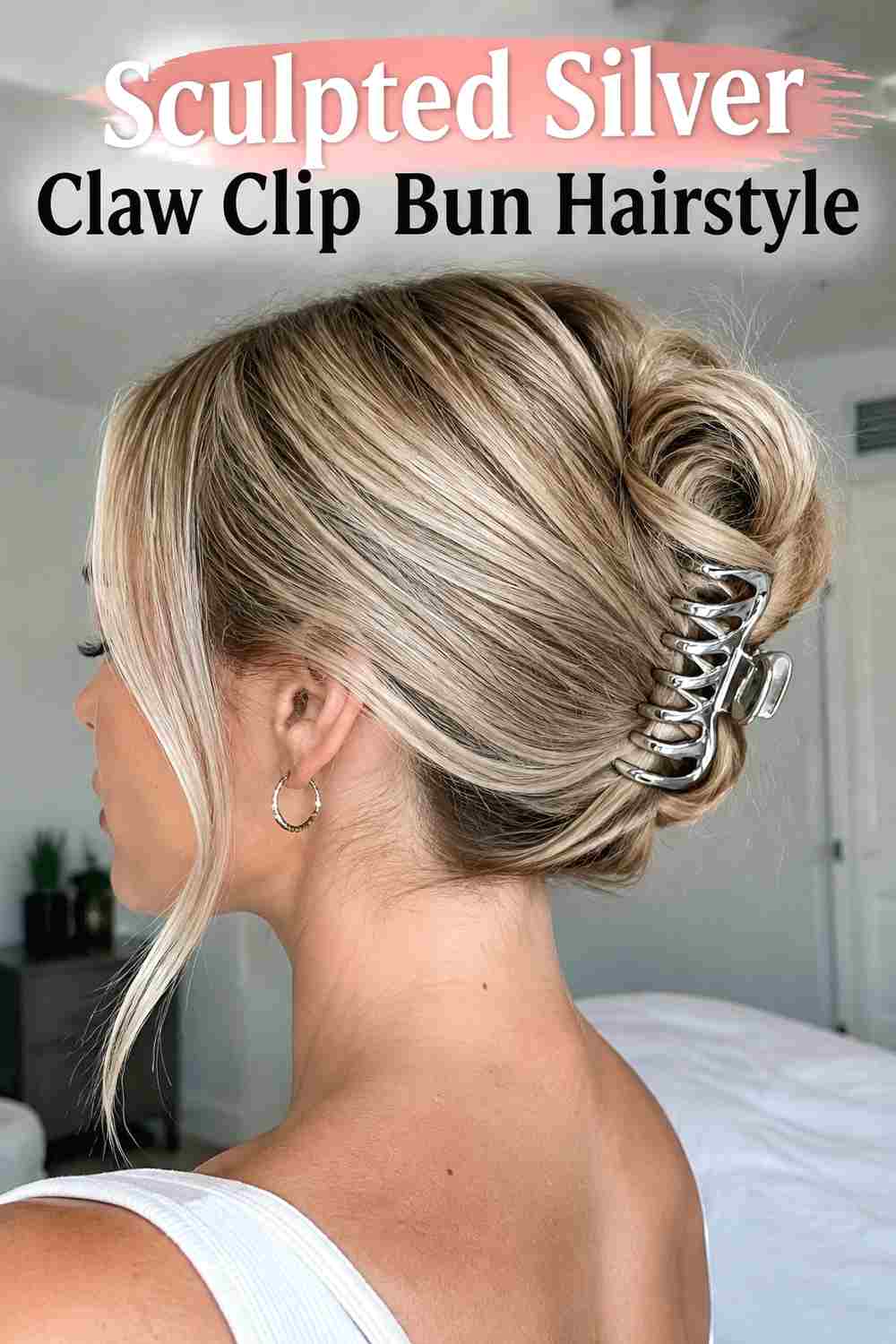 9. Sculpted Silver Claw Clip Bun Hairstyle
