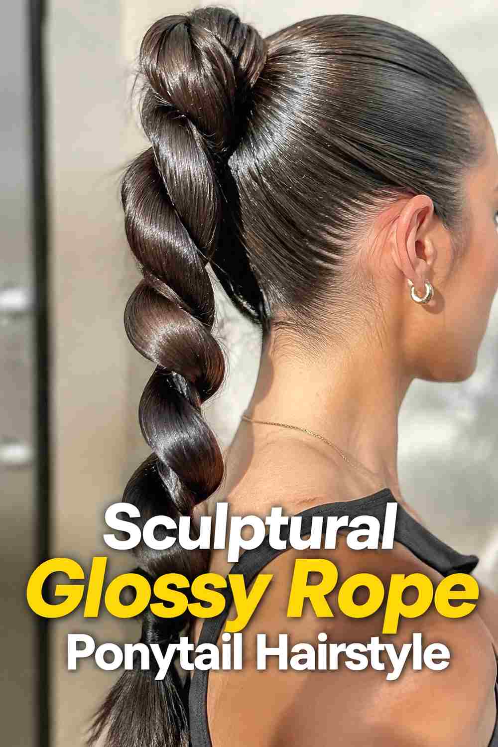 13. Sculptural Glossy Rope Ponytail Hairstyle