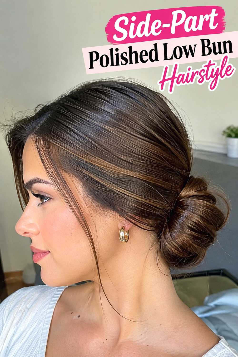 9. Side Part Polished Low Bun Hairstyle