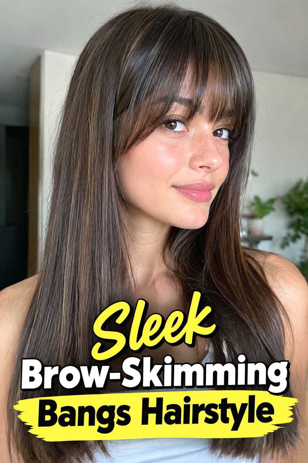 13. Sleek Brow Skimming Bangs Hairstyle