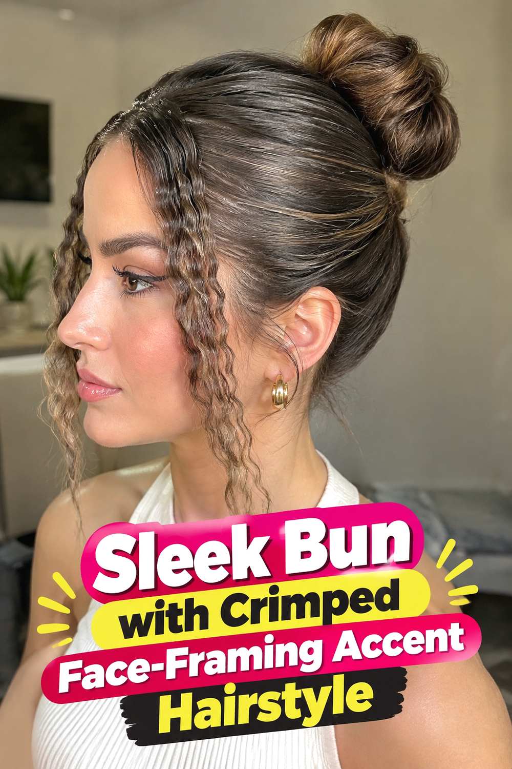 Sleek Bun with Crimped Face-Framing Accent Hairstyle