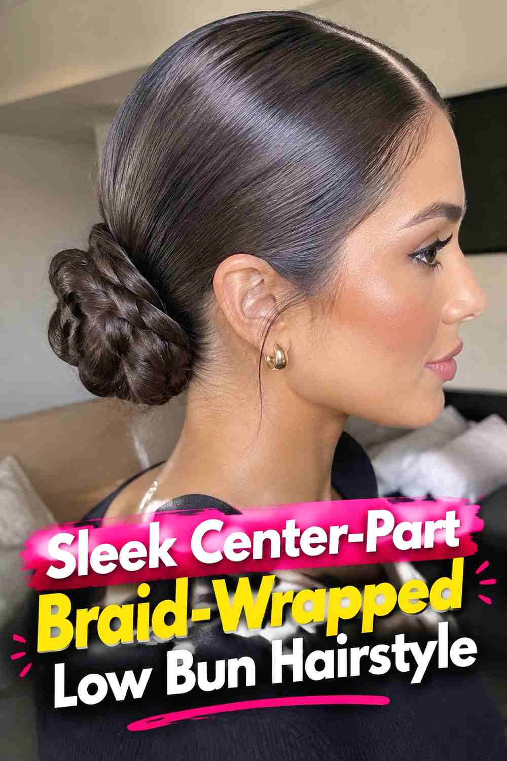 2. Sleek Center Part Braid Wrapped Low Bun Hairstyle
