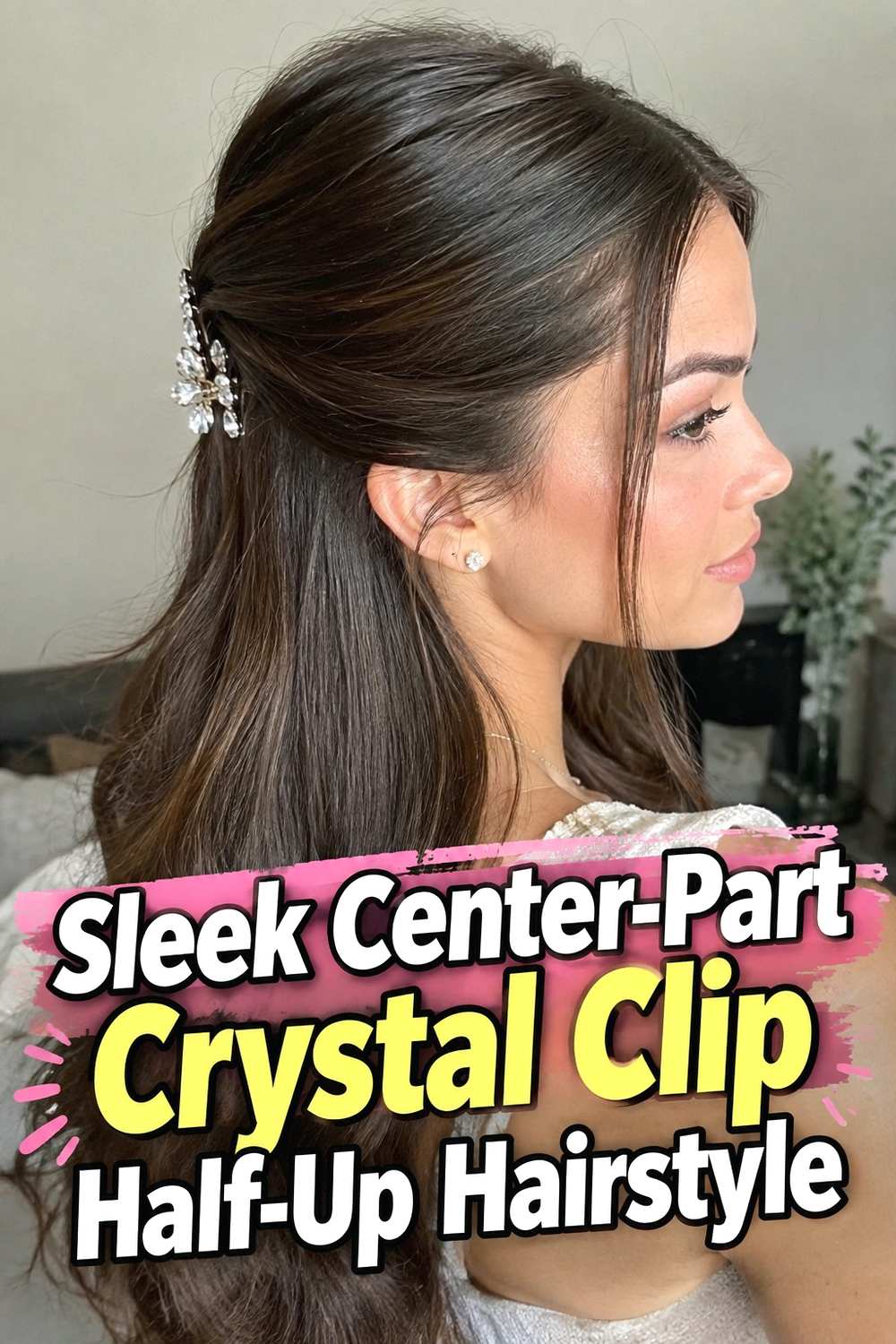 2. Sleek Center Part Crystal Clip Half Up Hairstyle