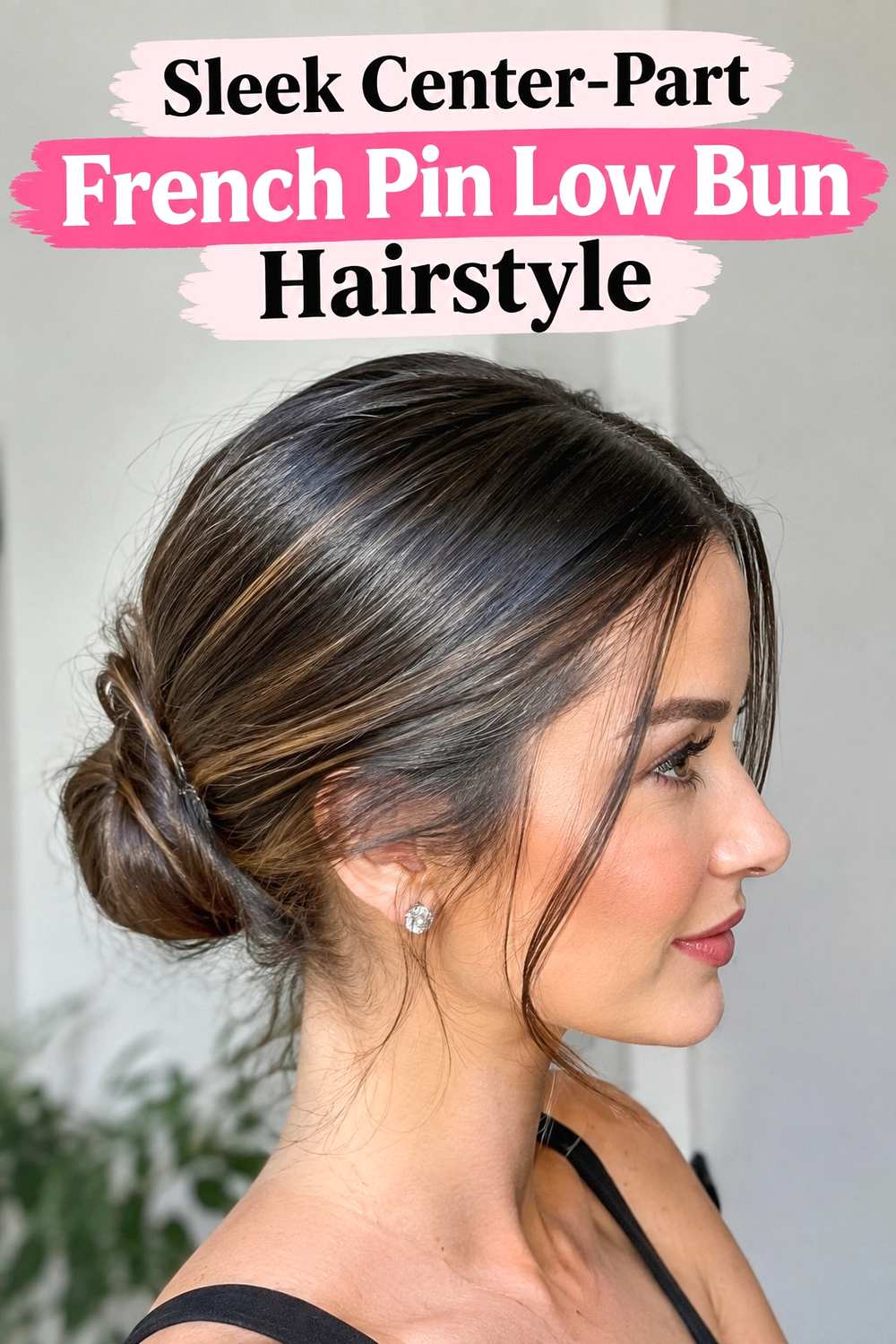 3. Sleek Center Part French Pin Low Bun Hairstyle