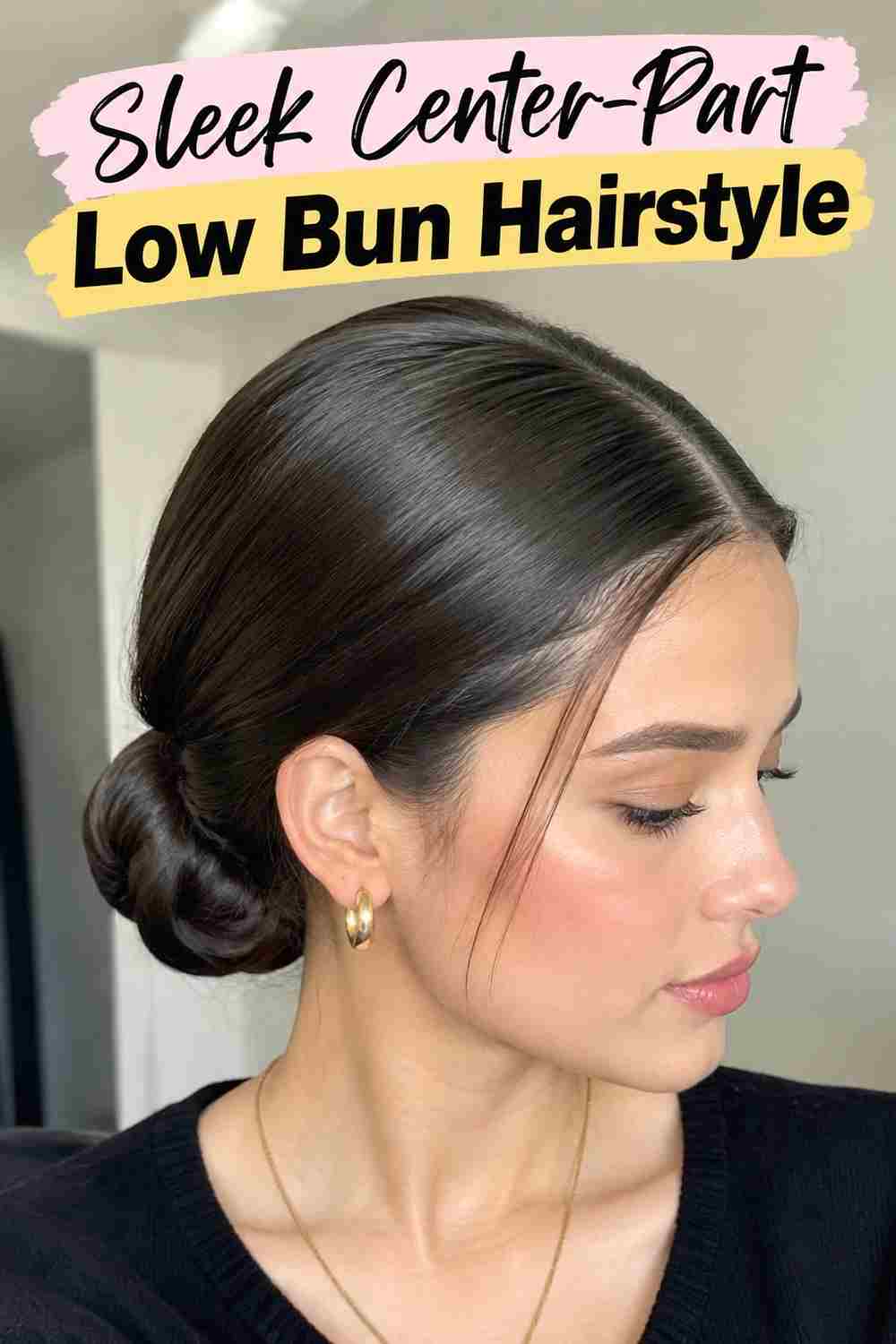 3. Sleek Center Part Low Bun Hairstyle