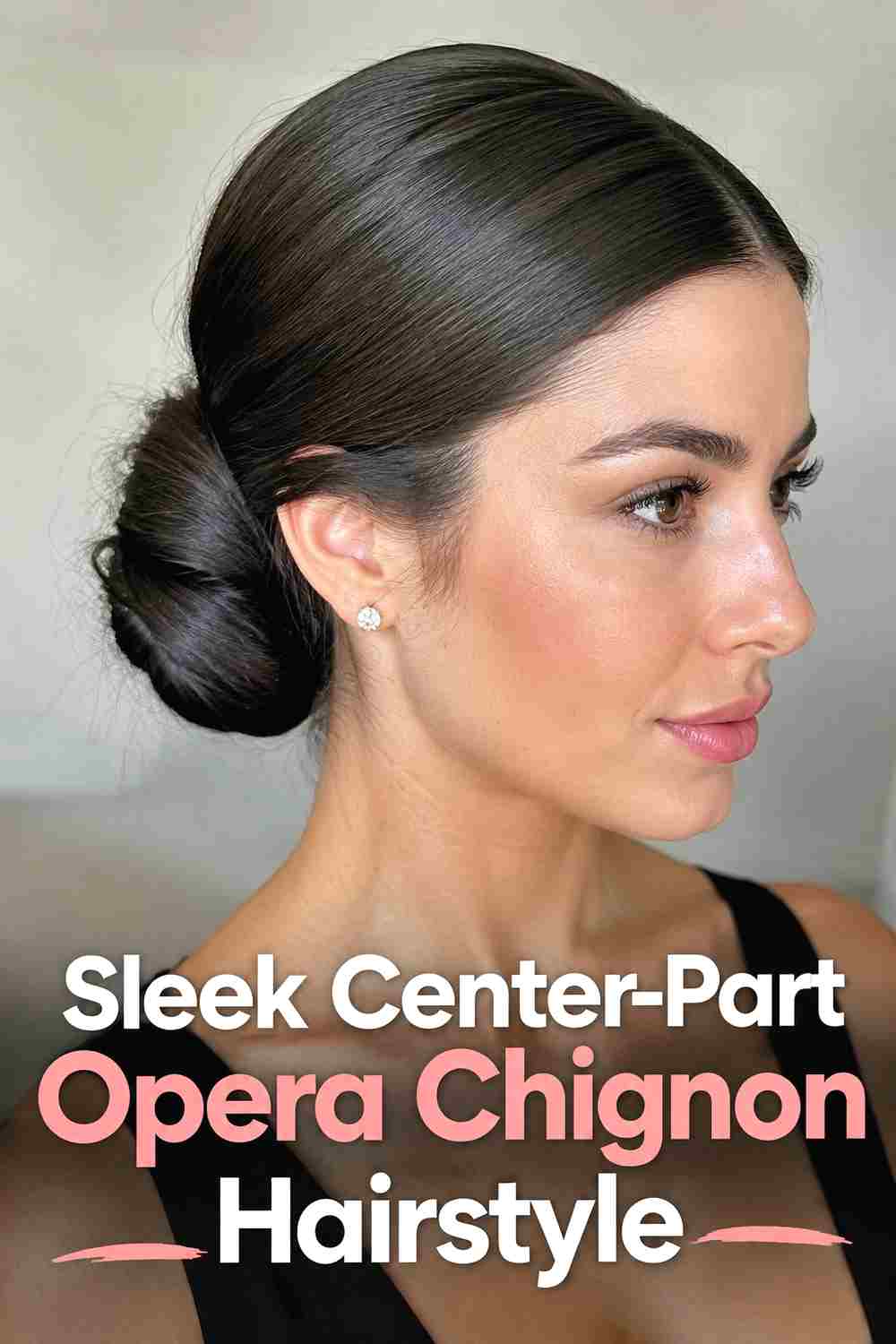 2. Sleek Center Part Opera Chignon Hairstyle