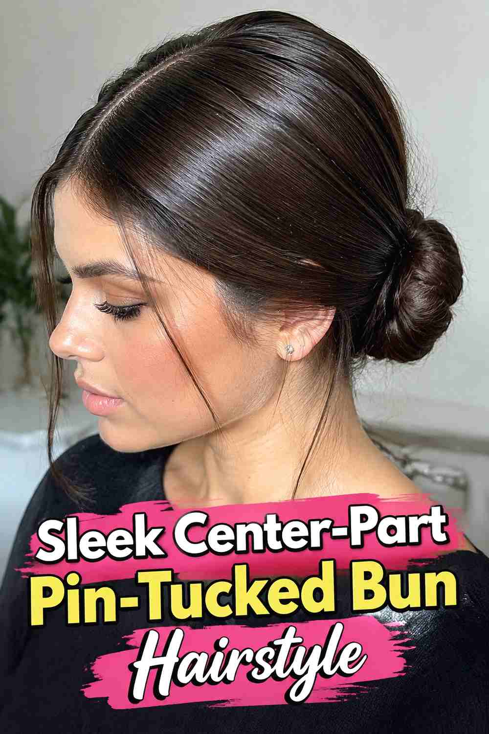 2. Sleek Center Part Pin Tucked Bun Hairstyle