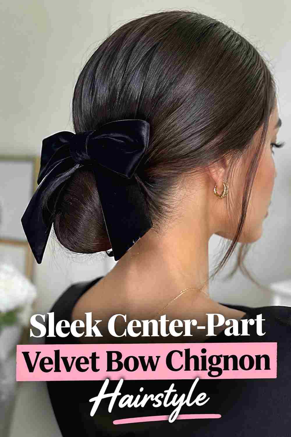 3. Sleek Center Part Velvet Bow Chignon Hairstyle