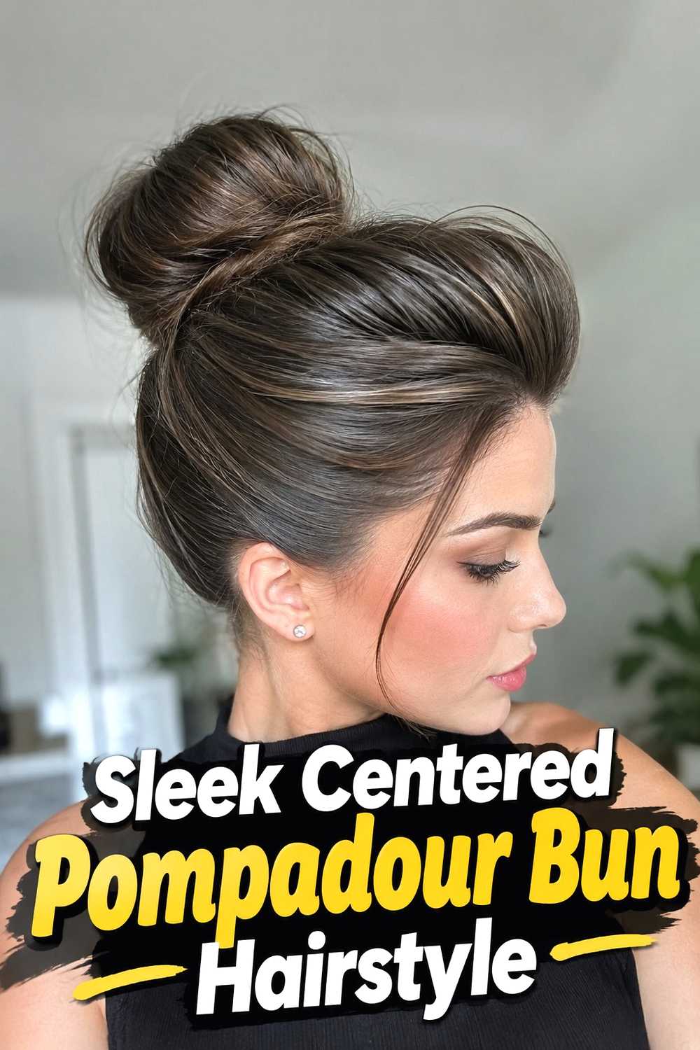 12. Sleek Centered Pompadour Bun Hairstyle
