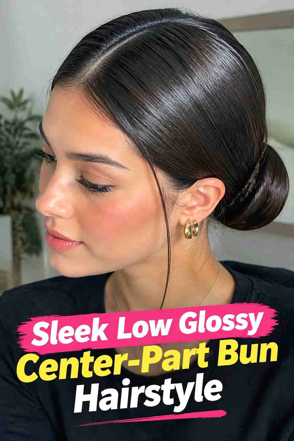 1. Sleek Low Glossy Center Part Bun Hairstyle