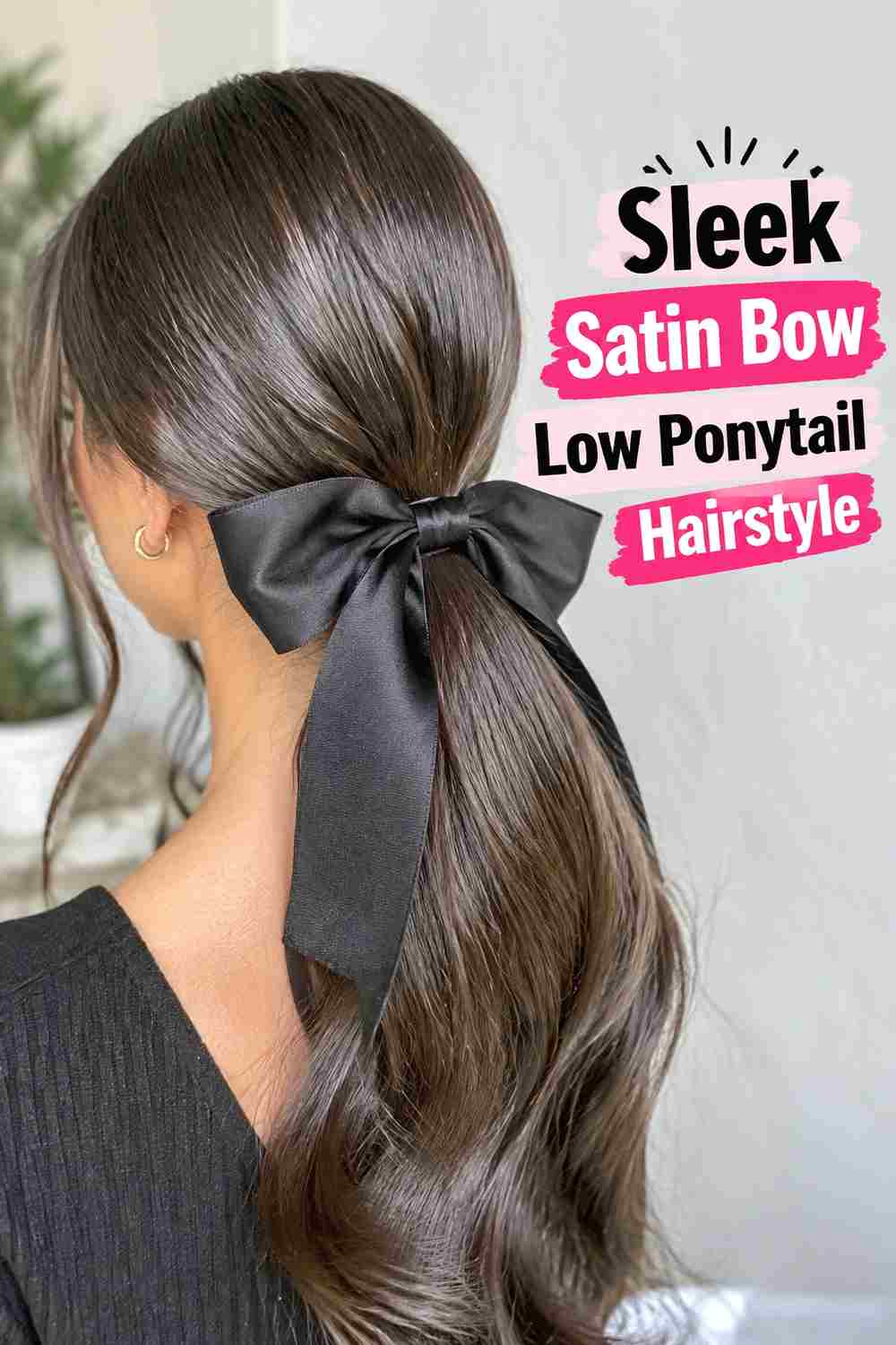 2. Sleek Satin Bow Low Ponytail Hairstyle