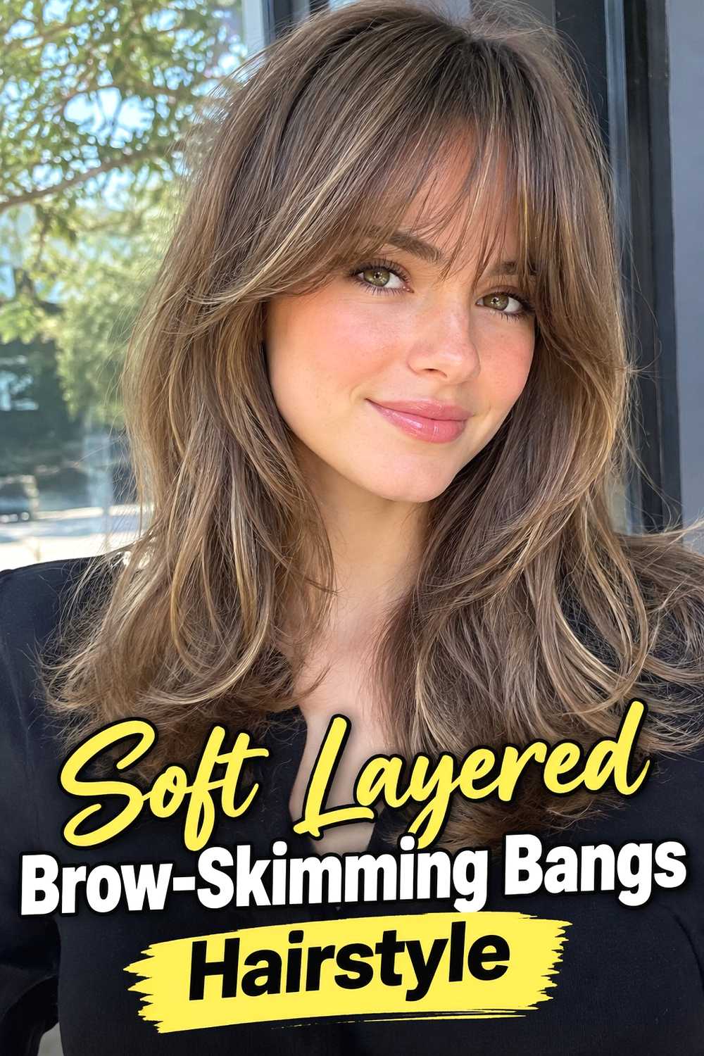 1. Soft Layered Brow Skimming Bangs Hairstyle