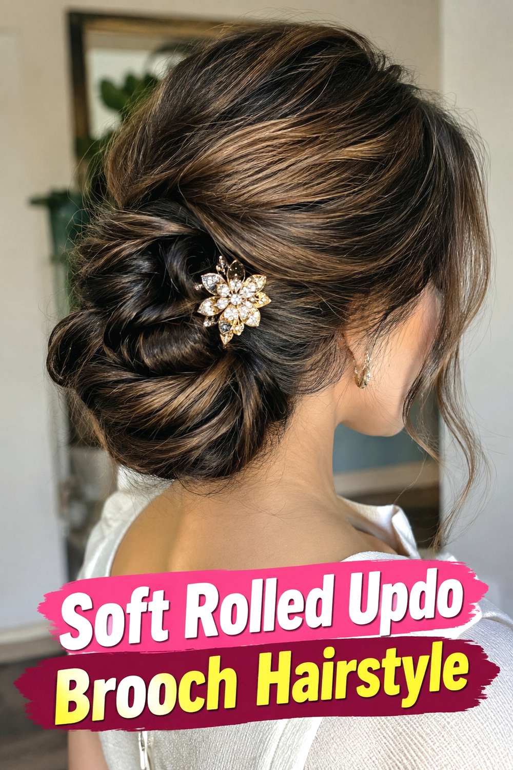 9. Soft Rolled Updo Brooch Hairstyle