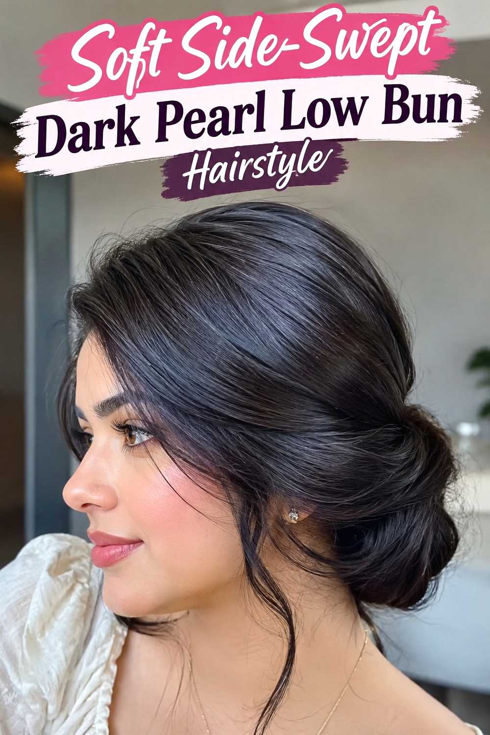 13. Soft Side Swept Dark Pearl Low Bun Hairstyle