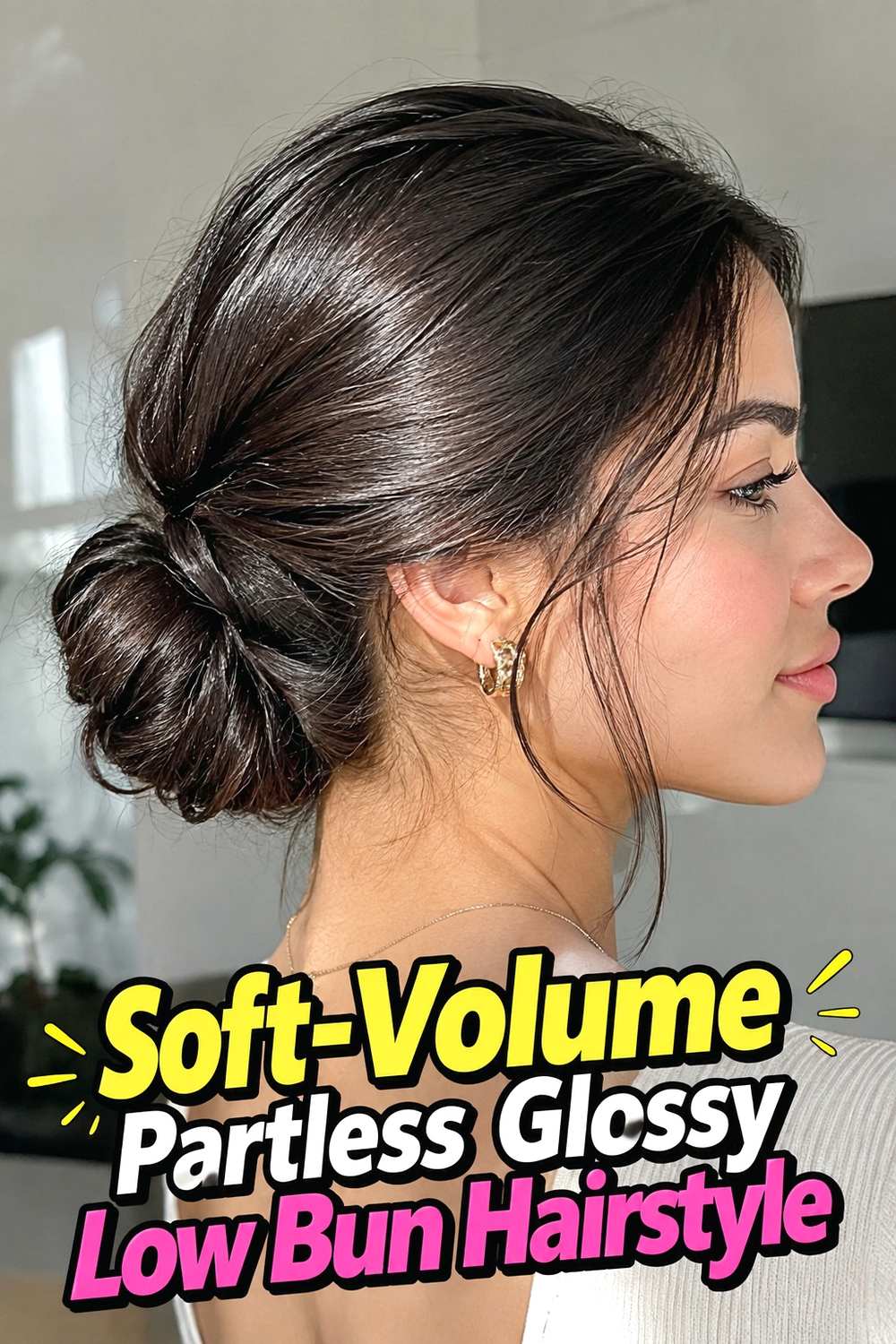 5. Soft Volume Partless Glossy Low Bun Hairstyle