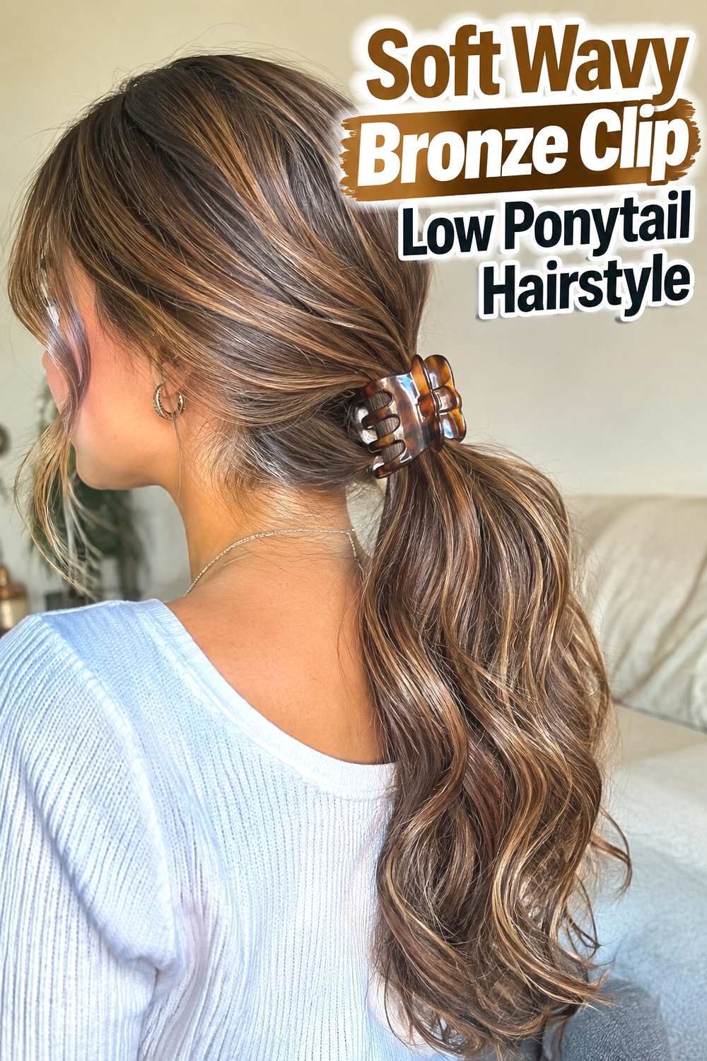 Soft Wavy Bronze Clip Low Ponytail Hairstyle