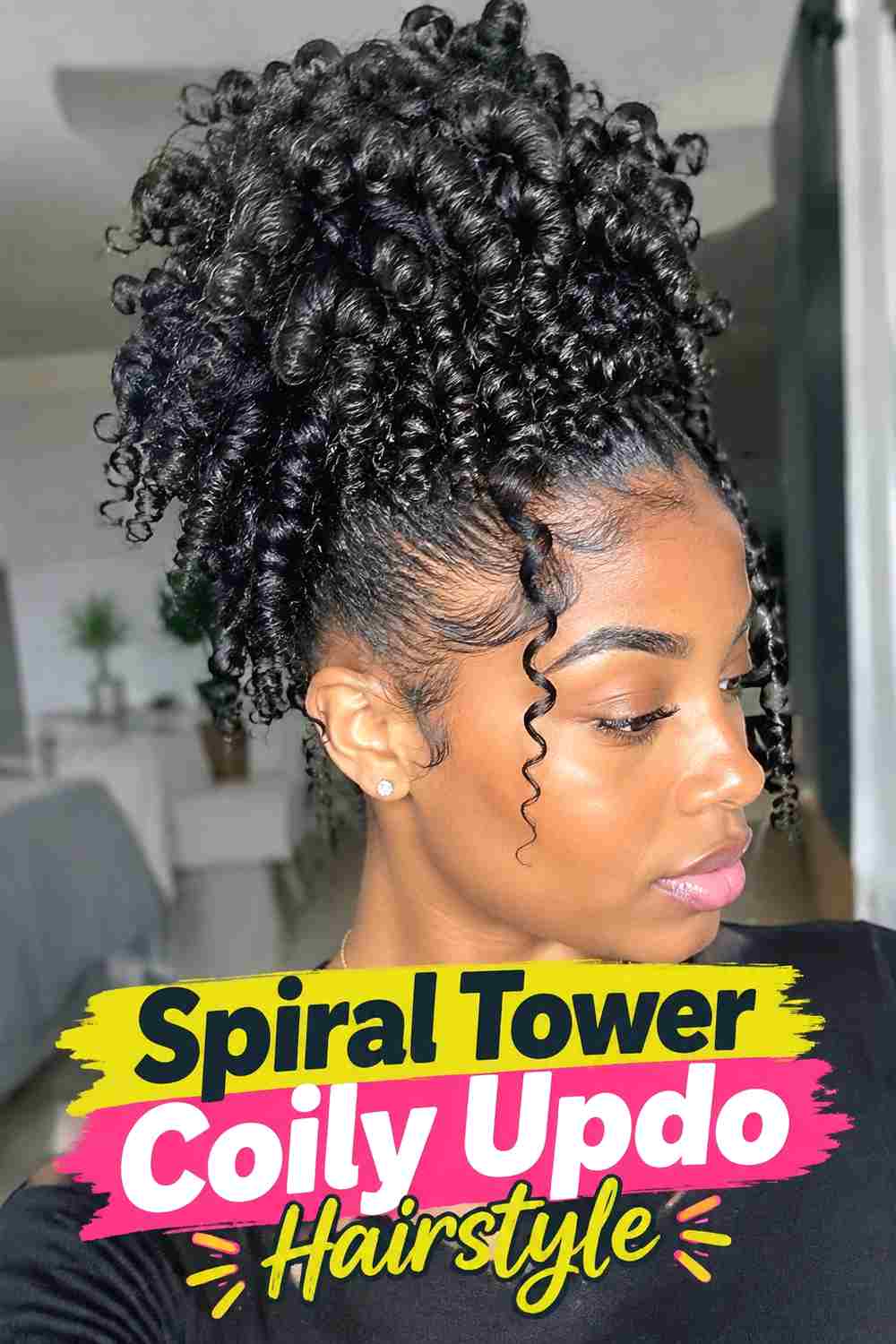 7. Spiral Tower Coily Updo Hairstyle