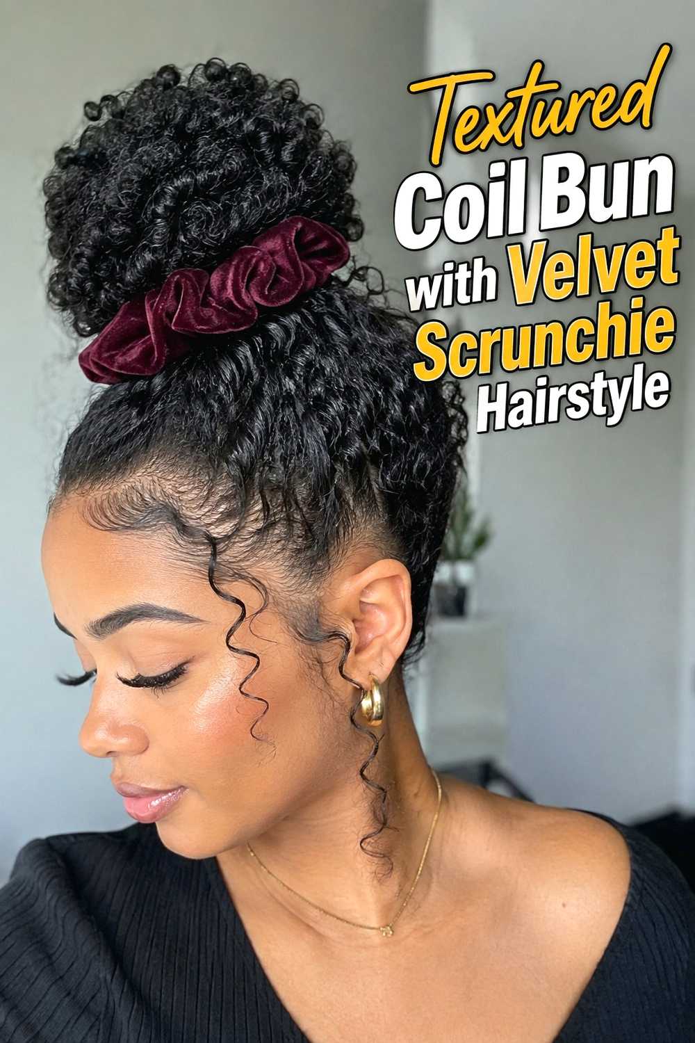 14. Textured Coil Bun With Velvet Scrunchie Hairstyle