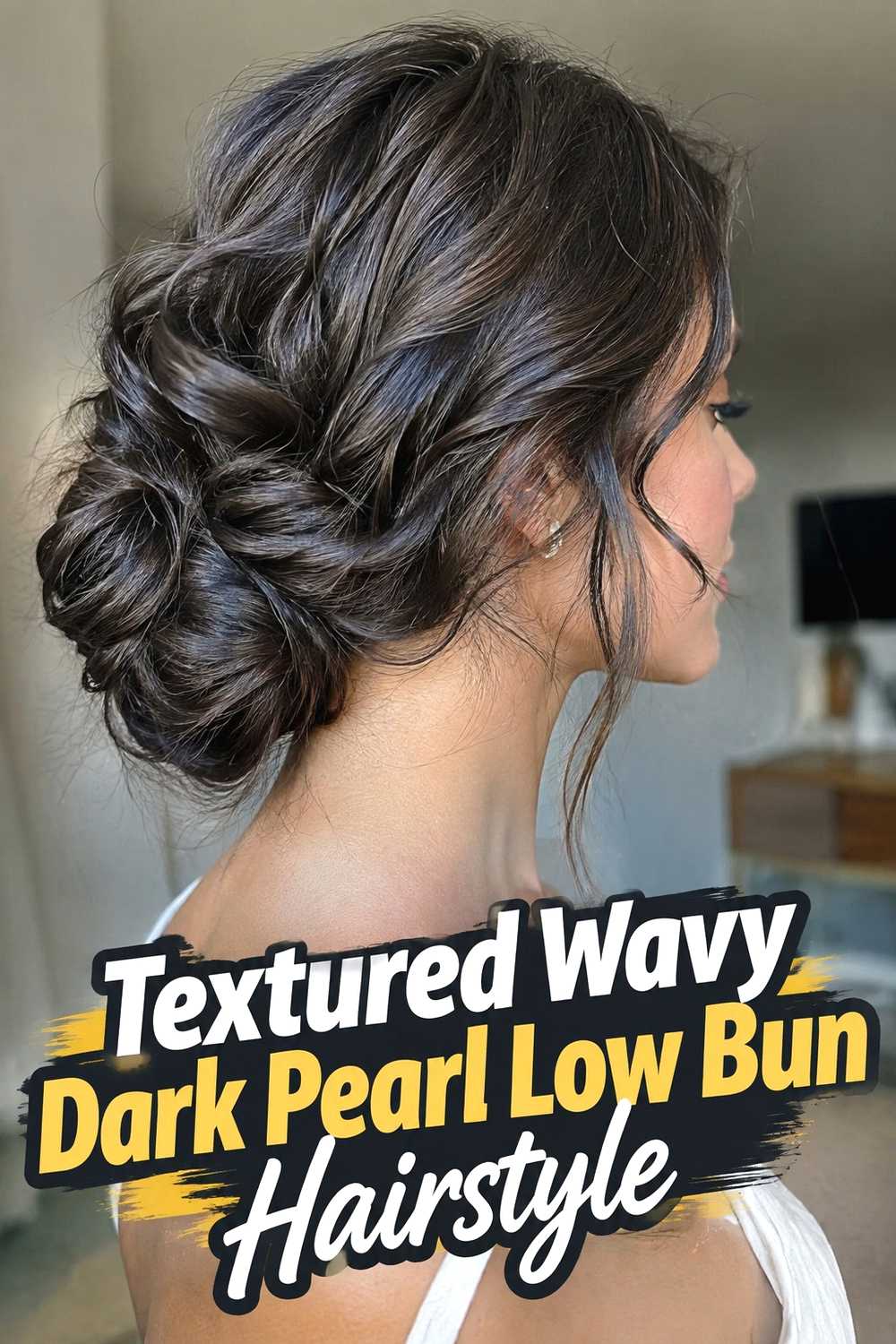 9. Textured Wavy Dark Pearl Low Bun Hairstyle