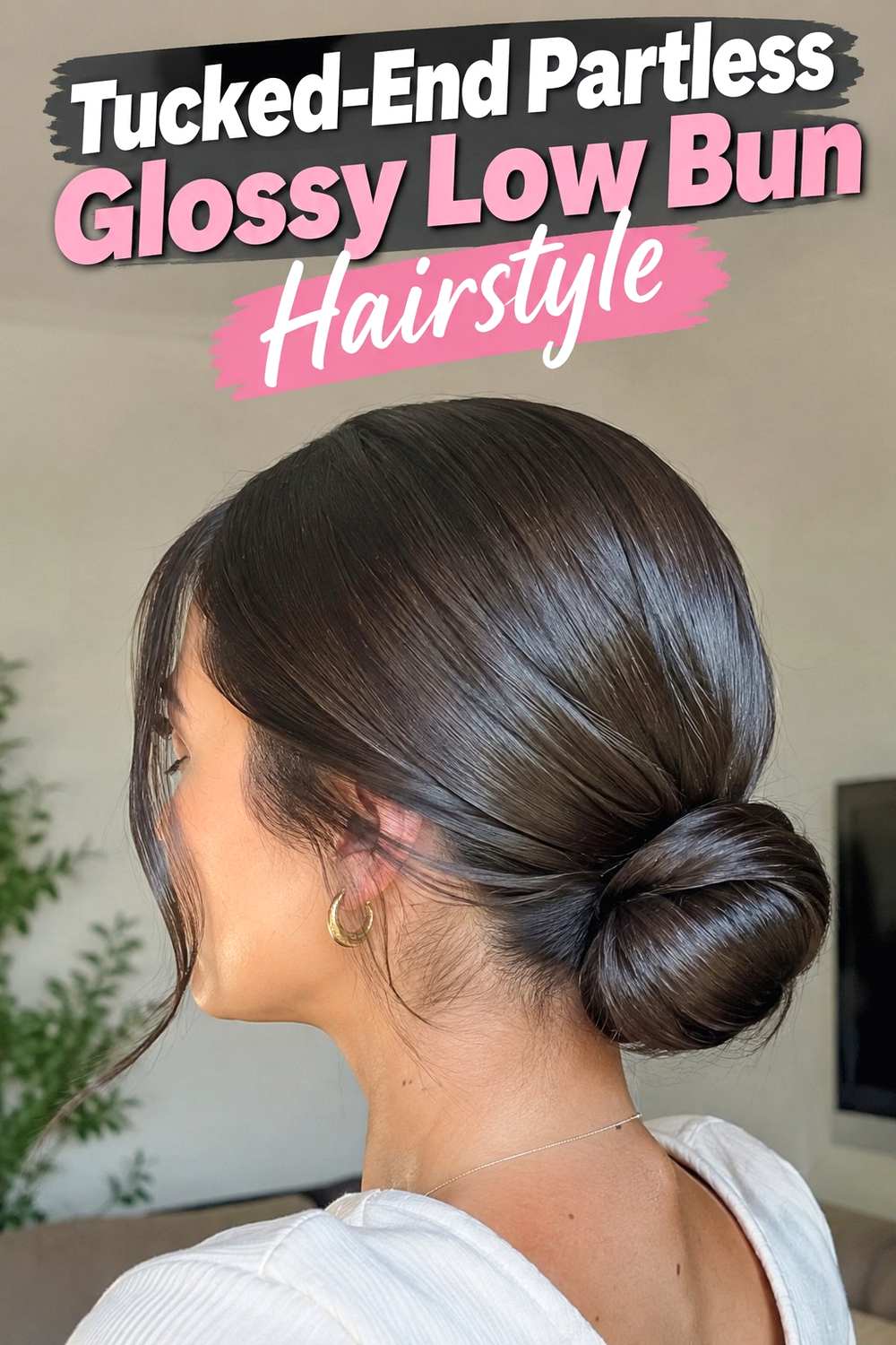9. Tucked End Partless Glossy Low Bun Hairstyle