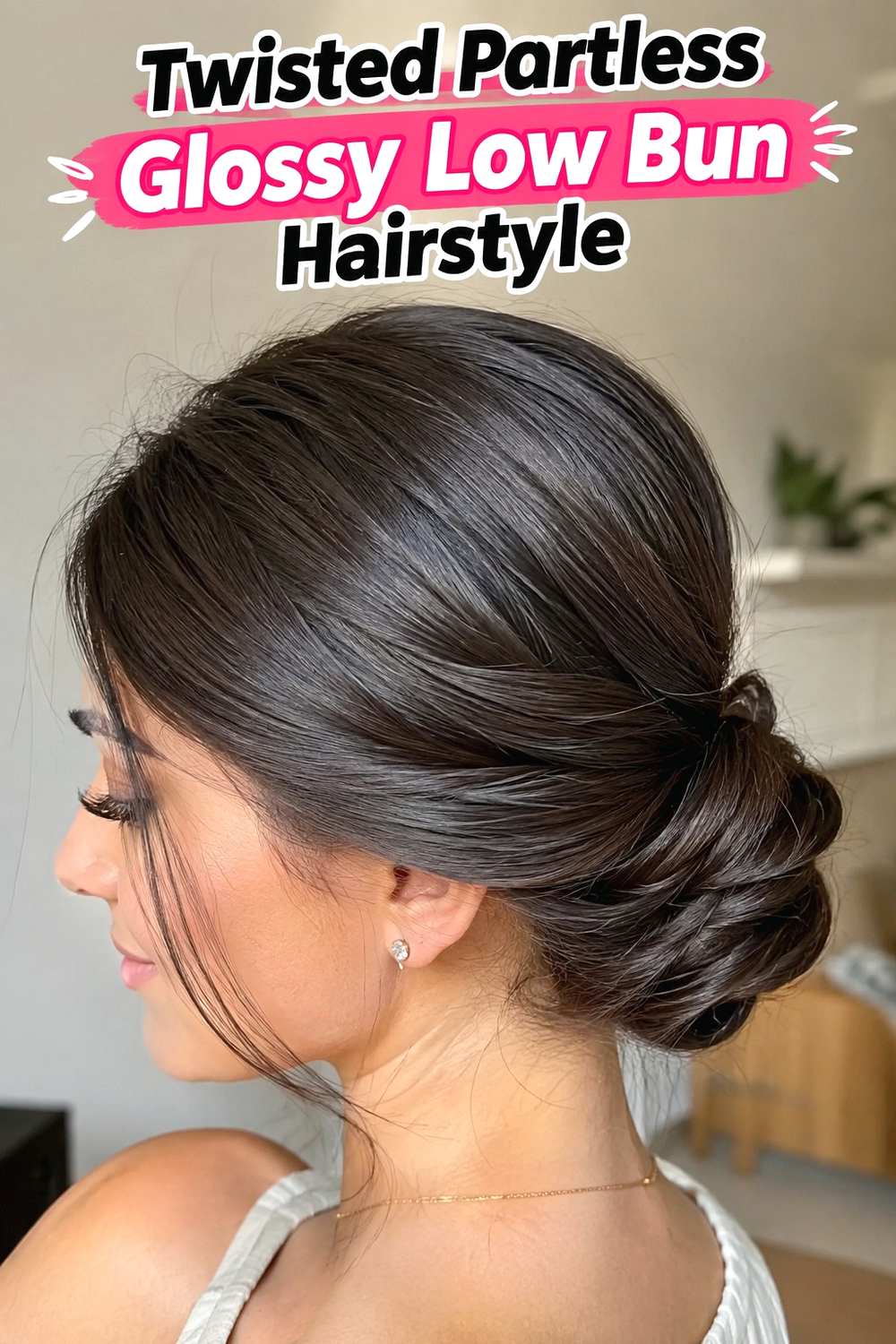 6. Twisted Partless Glossy Low Bun Hairstyle