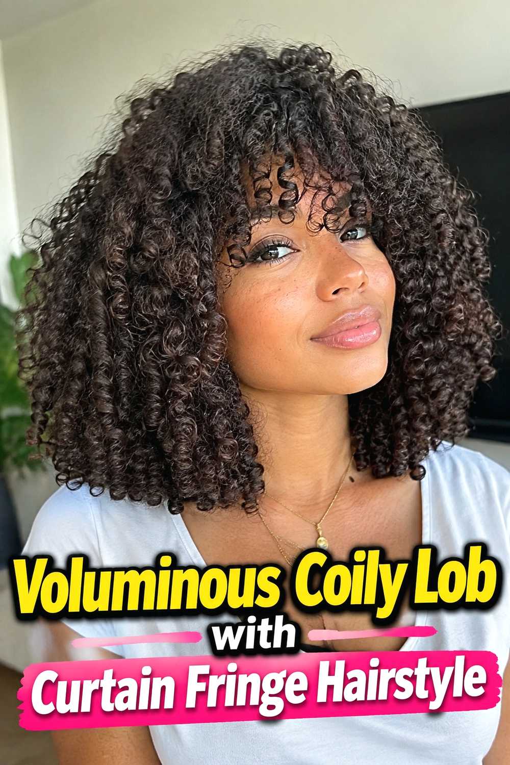 6. Voluminous Coily Lob With Curtain Fringe Hairstyle