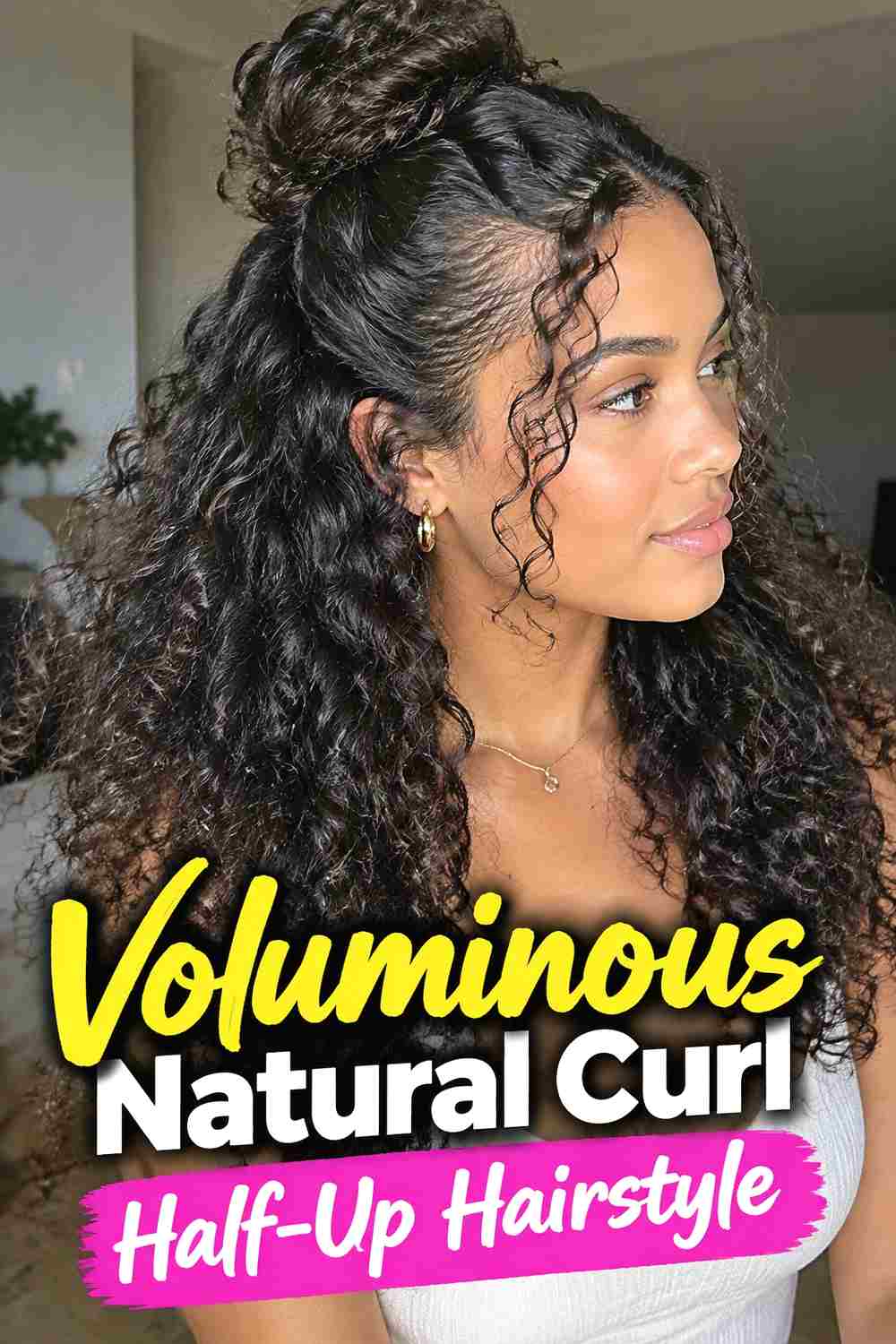 7. Voluminous Natural Curl Half Up Hairstyle