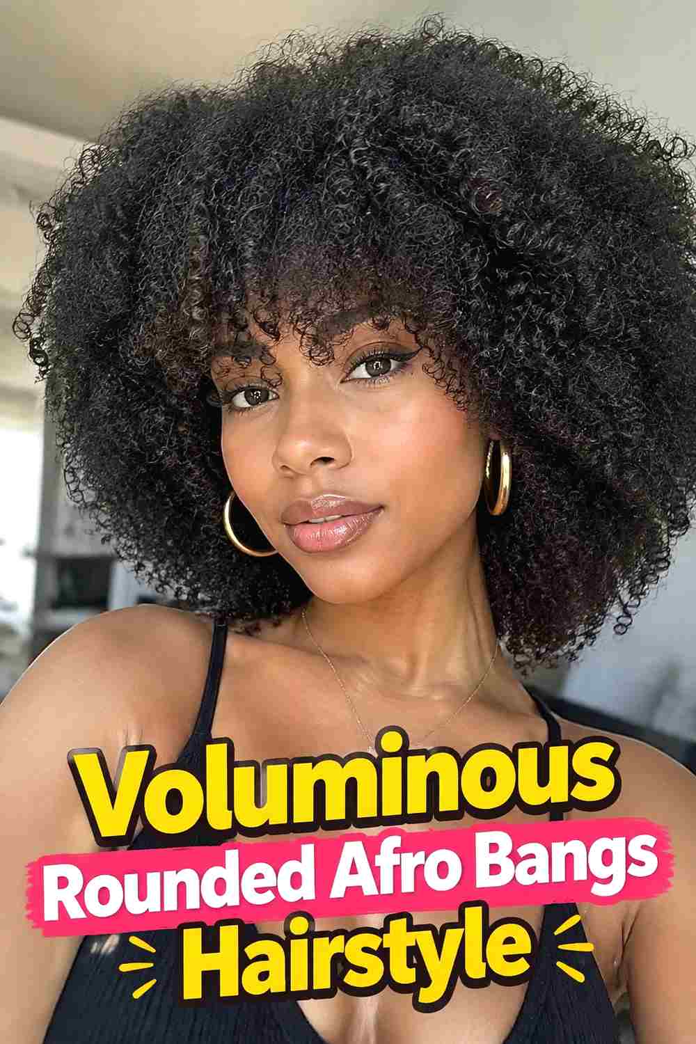 12. Voluminous Rounded Afro Bangs Hairstyle
