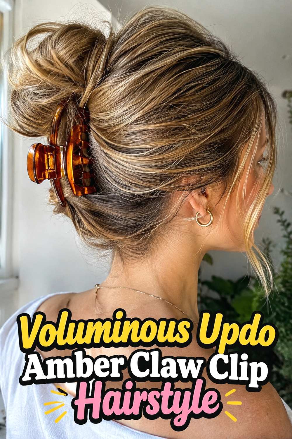 12. Voluminous Updo Amber Claw Clip Hairstyle