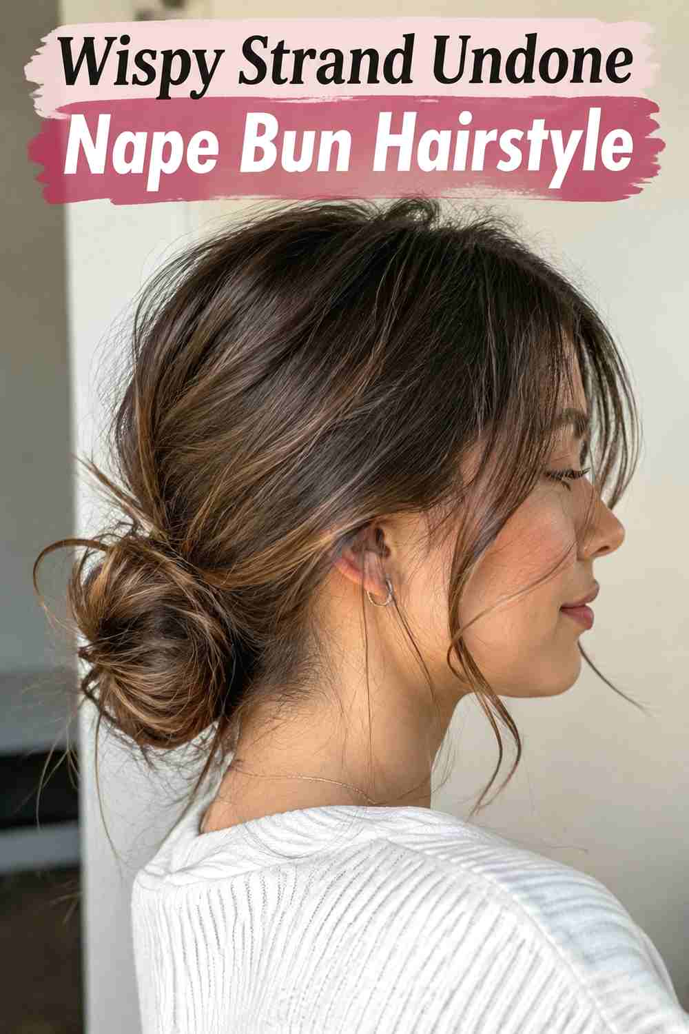 9. Wispy Strand Undone Nape Bun Hairstyle