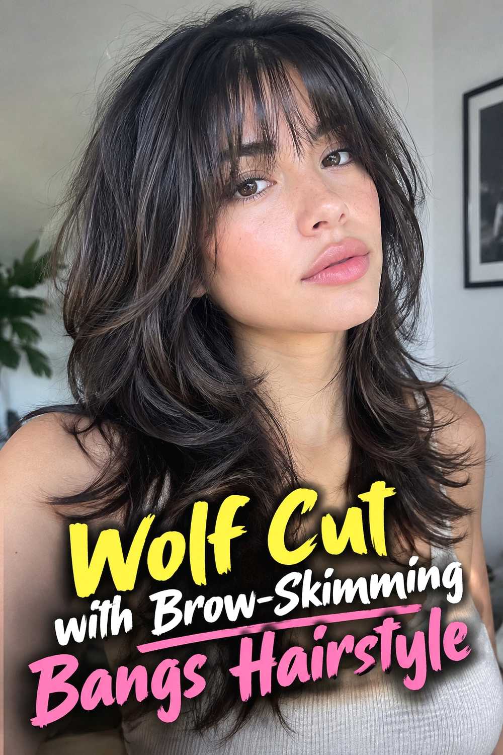 14. Wolf Cut With Brow Skimming Bangs Hairstyle
