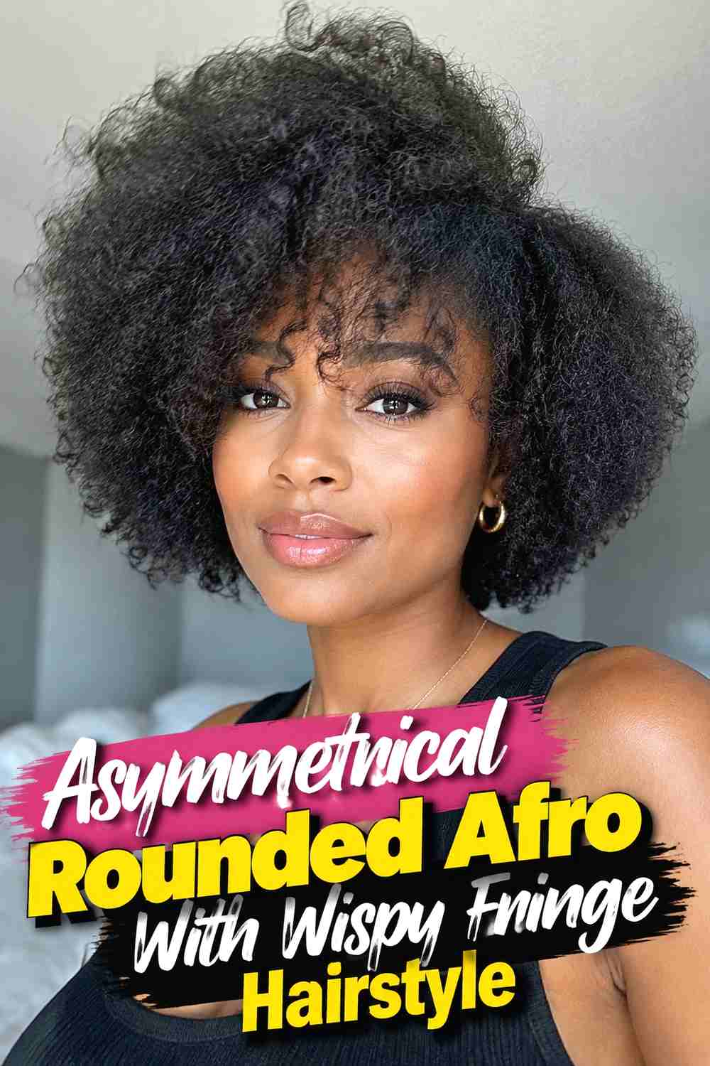 11. Asymmetrical Rounded Afro With Wispy Fringe Hairstyle