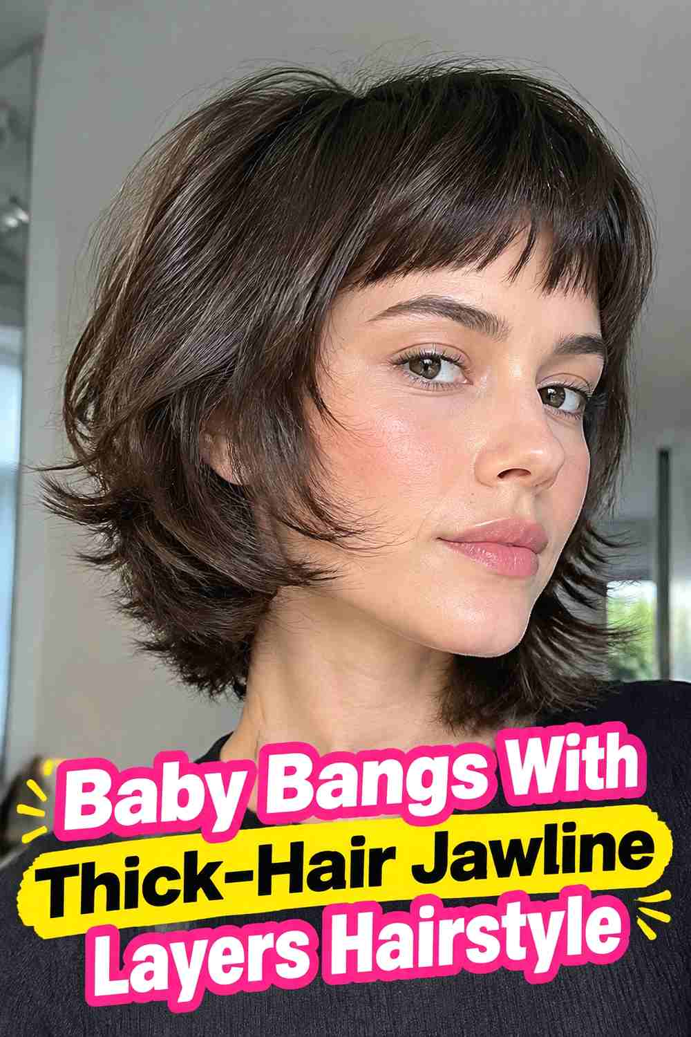 15. Baby Bangs With Thick Hair Jawline Layers Hairstyle