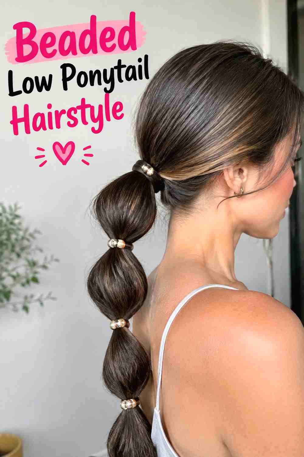 8. Beaded Low Ponytail Hairstyle