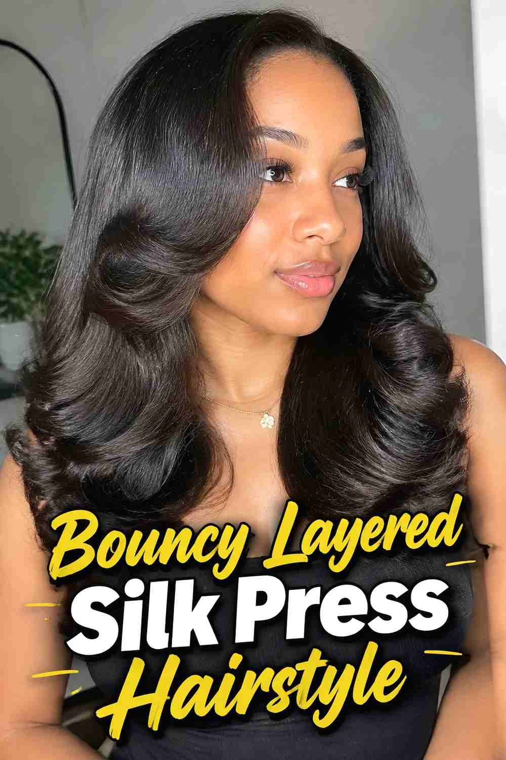 2. Bouncy Layered Silk Press Hairstyle