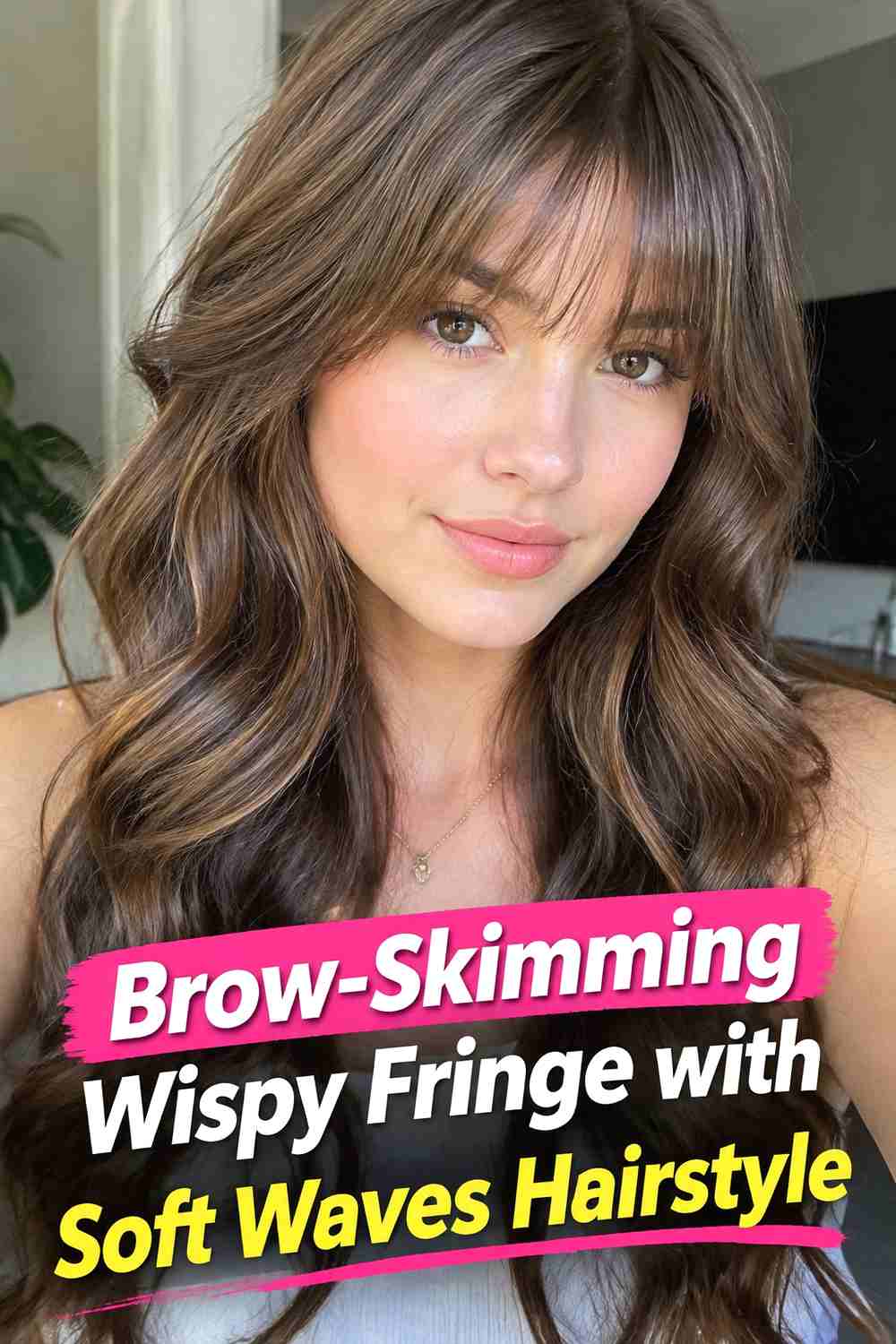 7. Brow Skimming Wispy Fringe With Soft Waves Hairstyle