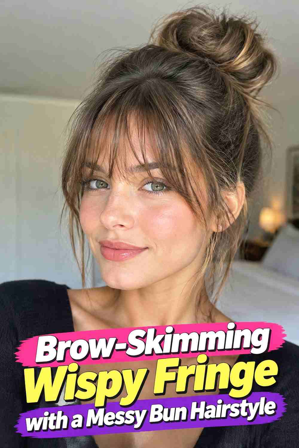 14. Brow Skimming Wispy Fringe With A Messy Bun Hairstyle
