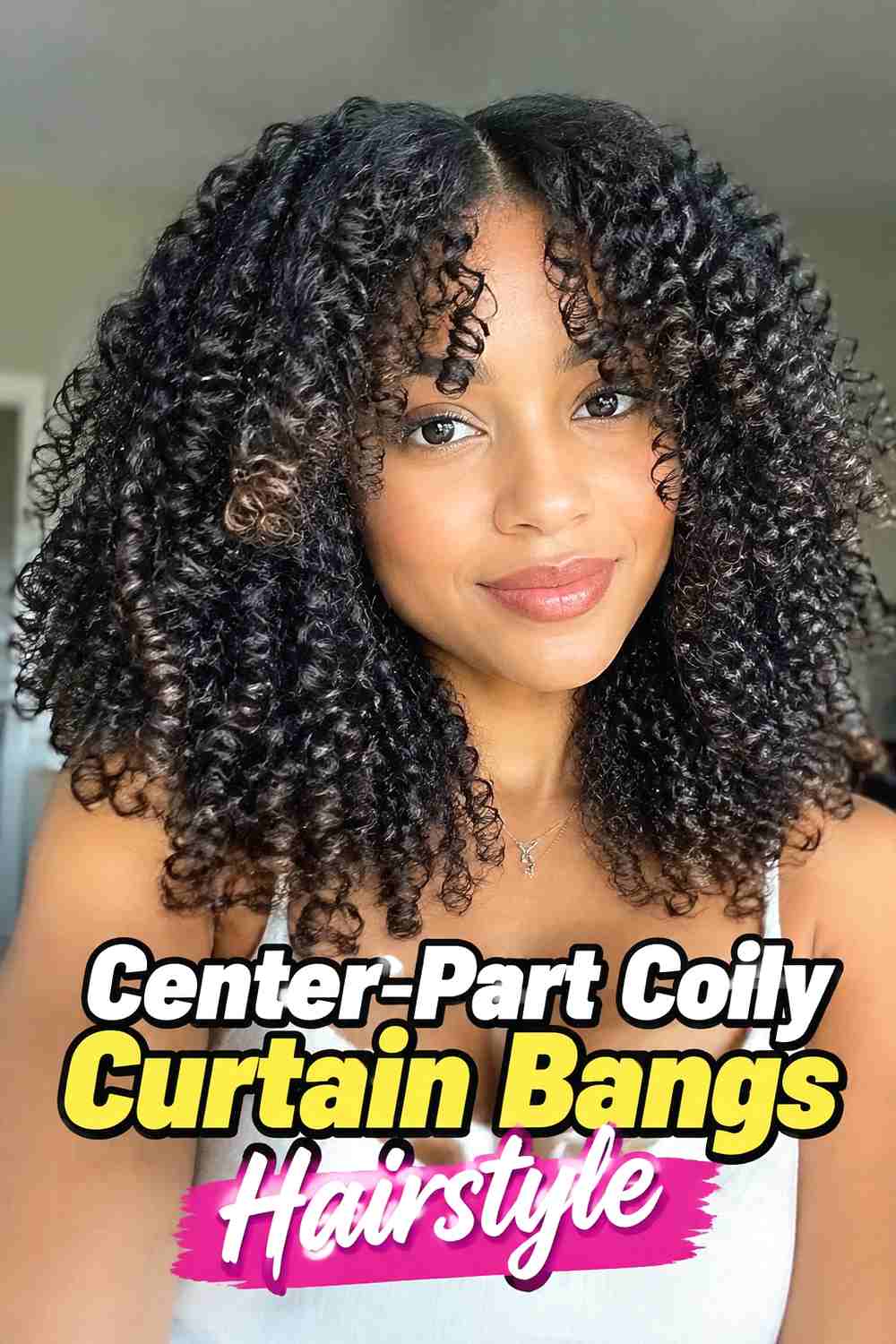 8. Center Part Coily Curtain Bangs Hairstyle