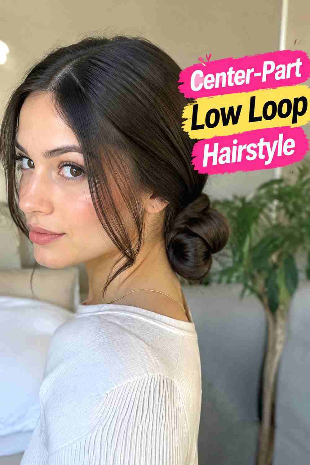 5. Center Part Low Loop Hairstyle