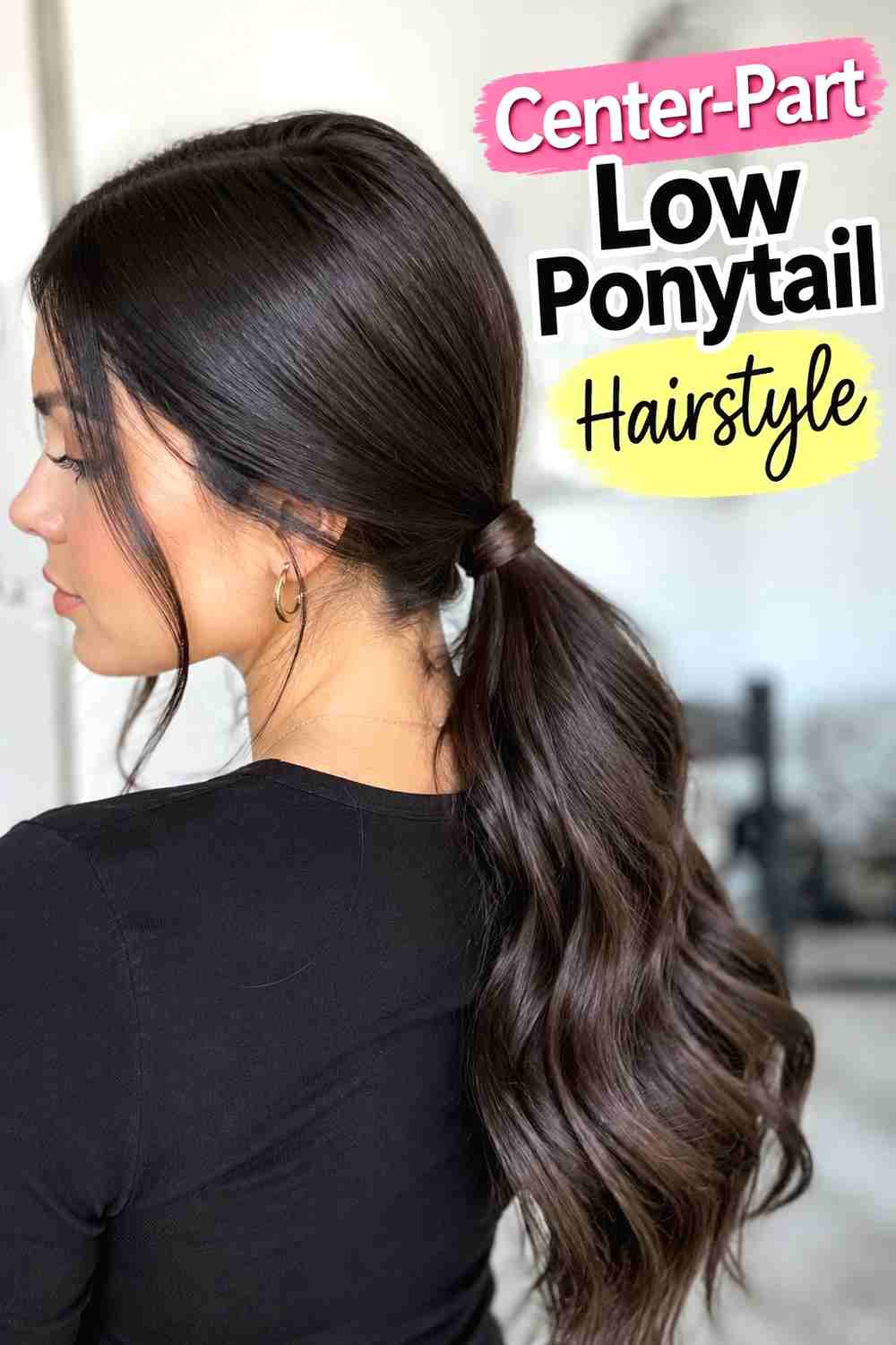 2. Center Part Low Ponytail Hairstyle