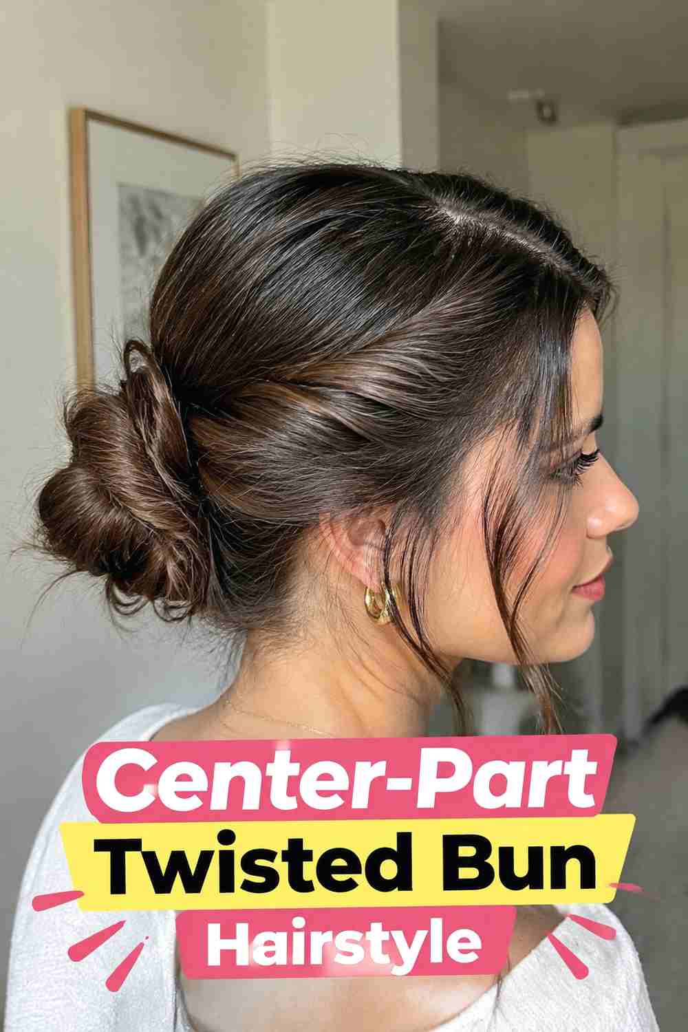 2. Center Part Twisted Bun Hairstyle